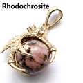 Golden dragon claw pendant clutching a round pink rhodonite stone bead accessory - Rhodonite