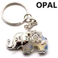 Olifant sleutelhanger met doorschijnende opaliet steen en zilveren afwerking - Opaal