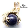 Golden dragon claw pendant featuring a blue sandstone sphere and sparkling accents - Blue Sandstone