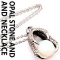 Close-up detail of vintage medieval style dragon claw pendant clutching white opal stone bead - Opal With Necklace