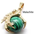 Detailed gold dragon claw pendant holding a green malachite round bead for necklaces - Malachite