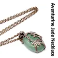 Vintage bronze finish necklace featuring a green stone oval pendant with intricate floral design - Aventurine