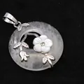 Elegant clear quartz round pendant featuring silver floral detailing and a mother of pearl flower - Pendant Only (Without Chain) / White Crystal
