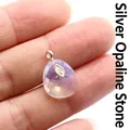 Teardrop-shaped iridescent opal pendant with silver-tone setting and faceted details - Silver Opalite