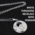 Elegant white turquoise donut pendant necklace with a mother-of-pearl flower accent - Necklace Set / Howlite