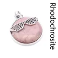 Unique pink rhodochrosite pendant featuring a decorative black crystal sunglasses design - Rhodonite