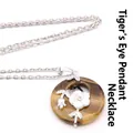 Elegant tiger eye stone donut pendant necklace with delicate white flower charm detail - Necklace Set / Tiger's Eye