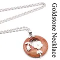 Vintage goldstone circular pendant necklace featuring a delicate silver flower design - Necklace Set / Gold Sandstone