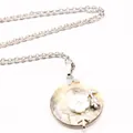 Elegant silver chain necklace with circular shell pendant and white flower detail - Necklace Set / Yellow Shell