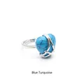 Elegant silver-tone heart-shaped ring featuring a polished blue turquoise stone inlay - Blue Turquoise