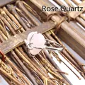 Elegant heart-shaped natural rose quartz ring with delicate bow detail in silver finish - Rose Quartz
