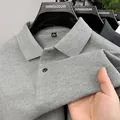 Polo da uomo in cotone piqué grigio con trama traspirante e dettaglio colletto classico. - 165/M (Consigliato 45-57.5kg) / Top / Grigio