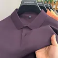 Close-up of purple men's cotton polo shirt showing breathable piqué fabric texture - Purple