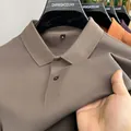 Close-up of a brown 100% cotton men's polo shirt showing the honeycomb texture - Brown
