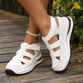 Close-up of white breathable hollow-out platform sandals with Velcro straps on feet - 35 / White (9928)