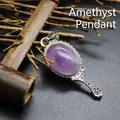 Elegant vintage silver magic mirror pendant featuring a polished oval purple amethyst stone - Amethyst
