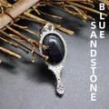 Blue sandstone magic mirror pendant with ornate silver-tone frame - Blue Sandstone