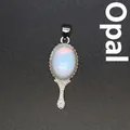 Vintage style silver metal hand mirror pendant featuring an oval iridescent opalite stone - Opal