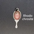 Natural rhodonite stone pendant featuring a vintage mirror design with silver filigree details - Rhodonite