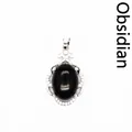 Elegante colgante ovalado de obsidiana negra con marco plateado calado microengastado - Obsidiana