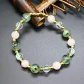 Macro view of natural stone bracelet with green prehnite and pink strawberry quartz beads - Light Green Prehnite Style / 8mm Bead