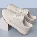 Detail of white pebbled leather men's casual sneakers with anti-slip brown sole - 36 / Beige With Ties