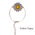 Vintage-Armreif aus Bronze mit Blume und einem gelben Topas-Edelstein in der Mitte - Topas