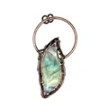 Detailed macro view of a raw labradorite stone pendant with rustic copper-tone metal frame - Labradorite (Ancient Bronze)