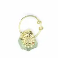 Detail showing the intricate golden sun face charm paired with a raw green crystal stone - Green Fluorite Sunflower (Gold)