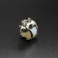 Silver frog prince charm pendant clutching a translucent white opalite bead - Opal
