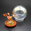 Detail of a natural stone tree of life micro-landscape with an iridescent glass dome - Red Agate