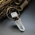 Close-up of a natural raw quartz crystal pendant with rustic metal wrap - Clear Quartz (Ancient Bronze)