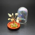 Close-up of crystal tree of life with iridescent glass dust cover for home decor - Citrine