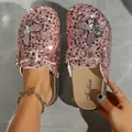 Close-up detail of pink sequin butterfly clogs with stylish buckle and thick sole - 36 / Pink