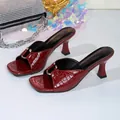 Detailed view of wine red crocodile pattern square toe mules with metal accents - 35 / Burgundy