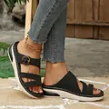 Detailed view of women's black wedge sandals with thick platform sole and buckle - 36 / Black