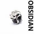 Artistic silver frog prince pendant holding a polished black natural obsidian bead - Obsidian