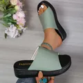 Detailed macro view of women's mint green ribbed fabric summer platform slide sandals - 36 / Light Green