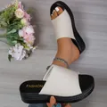 Detail view of women's ribbed fabric platform slide sandals with thick black soles - 36 / Off White