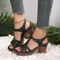 Close-up of black chunky heel sandals with cutout details and adjustable ankle strap. - 36 / Western Chunky Heel Sandals / Black