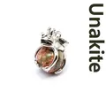 Exquisite frog prince pendant charm holding a natural unakite stone crystal sphere - Unakite