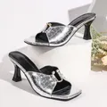 Close-up of metallic silver crocodile pattern square toe sandals with gold buckle - Silver