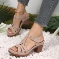 Elegant beige peep-toe chunky heel sandals featuring intricate cutout detail and adjustable ankle strap - Off White