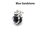 Silver-toned frog prince pendant holding a glittering blue sandstone crystal bead - Blue Sandstone