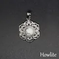 Elegant intricate flower lace silver-tone pendant with a natural white howlite stone. - White Turquoise (aljylp1545)