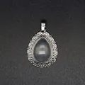 Elegant teardrop clear quartz pendant featuring an intricate silver filigree border design - Clear Crystal Pendant / White Crystal