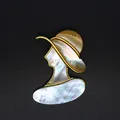 Detailed macro view of mother-of-pearl lady brooch with iridescent shell texture - Lady Portrait (Style 1) / Gold Style