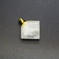 Detailed view of a square white natural stone perfume bottle pendant with a gold cap - White Crystal / Gold