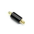 Close-up detail of black natural stone cylindrical essential oil vial pendant with gold caps - Obsidian / Gold