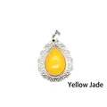 Elegant teardrop-shaped yellow stone pendant with an ornate silver-tone lace frame. - Topaz